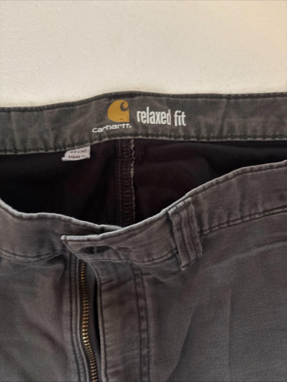 Carhartt Relaxed Fit Cargo Pants in Charcoal Gray tattered with holes